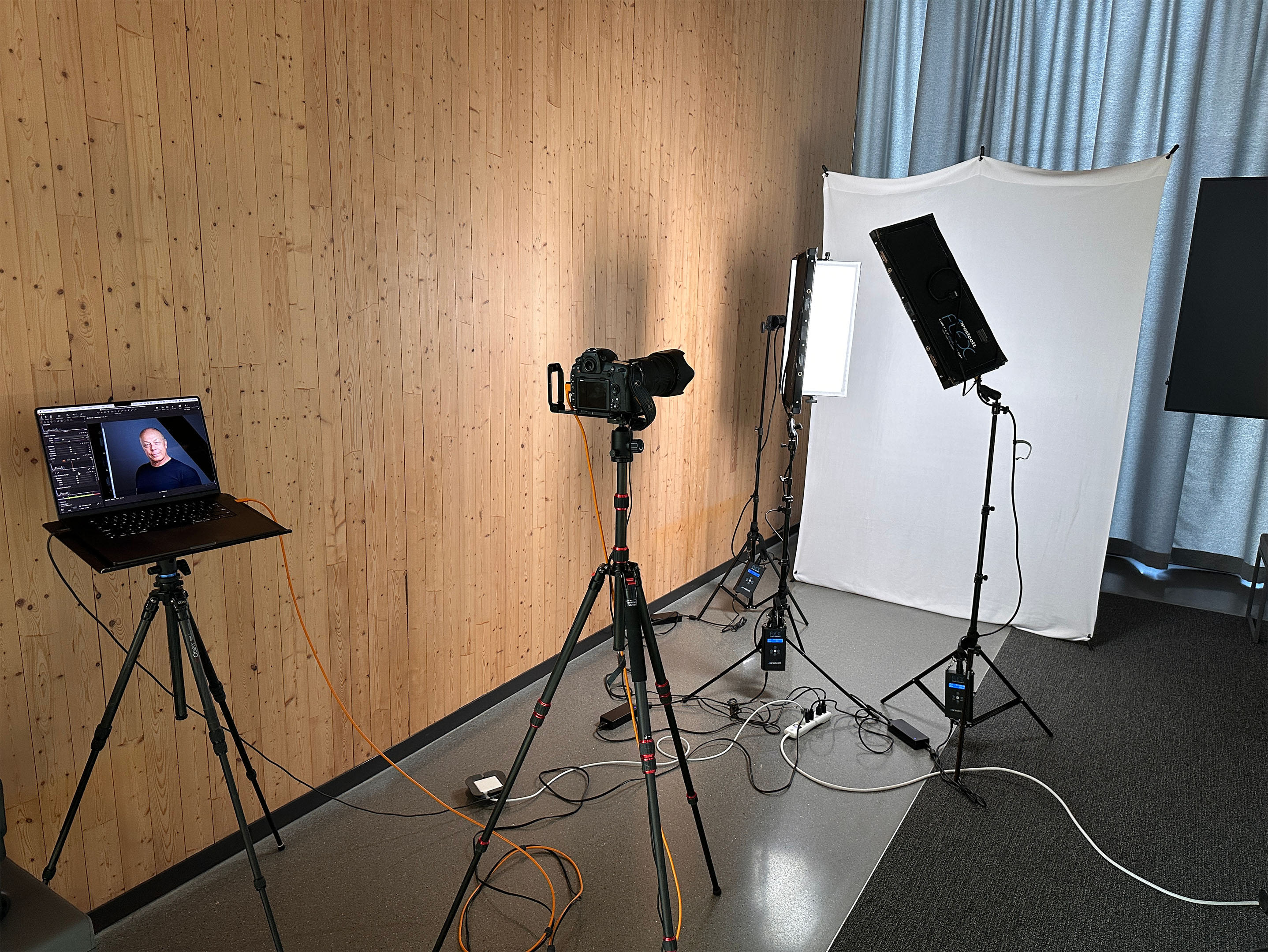 This image highlights Dean Birinyi’s professional corporate headshot studio setup in Santa Clara. The studio features precise lighting equipment, a tethered camera system, and a laptop for real-time image review, emphasizing the professionalism and attention to detail in corporate headshot photography.