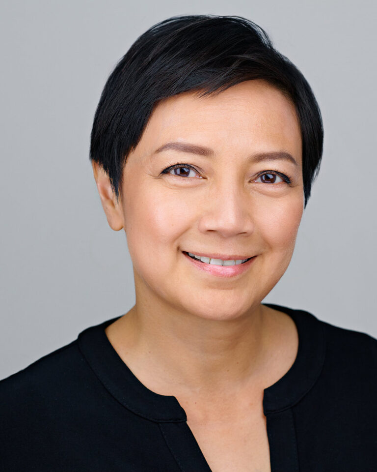 Professional headshot of a woman in Silicon Valley, showcasing confidence and approachability.