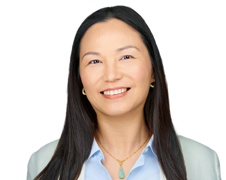 Professional headshot of a female executive in Fremont, showcasing a confident and approachable demeanor.