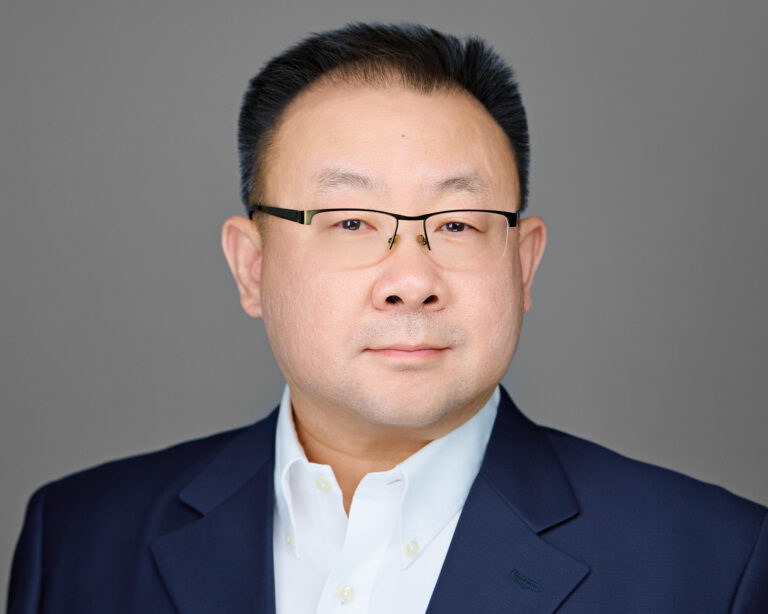 Professional headshot of a senior male executive in Fremont, showcasing confidence and professionalism.