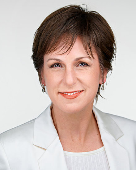A polished professional headshot by Dean Birinyi, showcasing confidence and authenticity in Palo Alto.