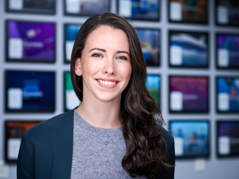 Businesswoman in gray sweater and dark jacket, photographed by Dean Birinyi for company headshots in Palo Alto.