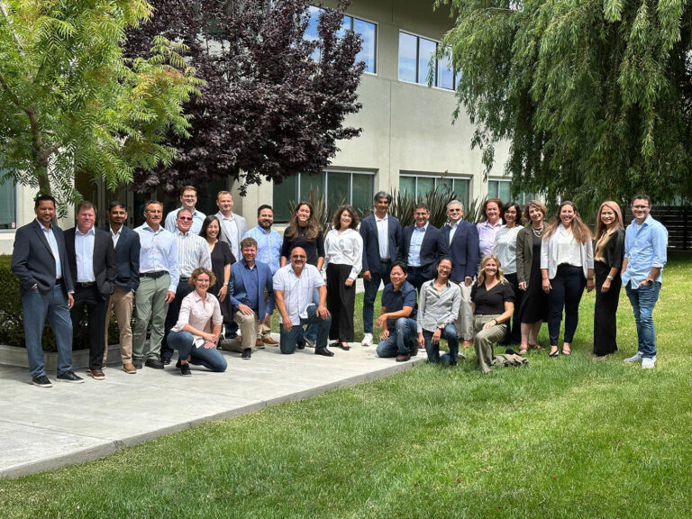 Large Redwood City corporate team outdoors, photographed by Dean Birinyi for company headshots and group portraits.