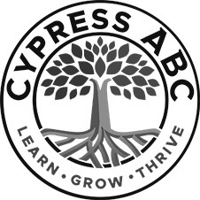 Cypress ABC logo with green tree and roots inside a circular emblem