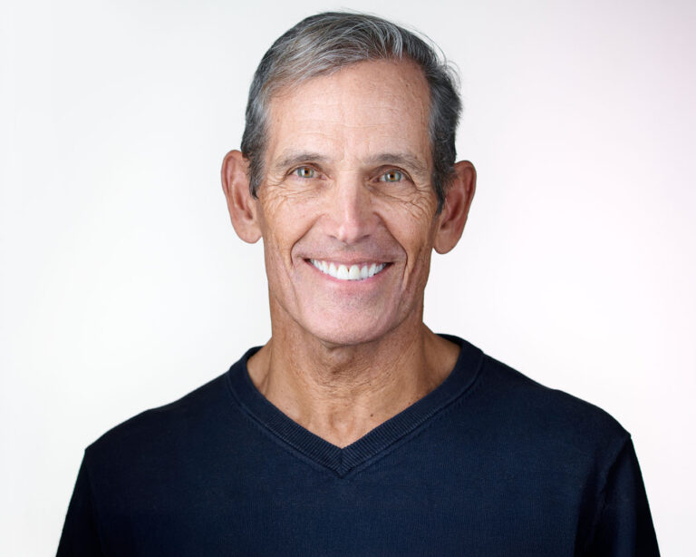 Professional headshot on a clean white background, photographed in Palo Alto for corporate use.