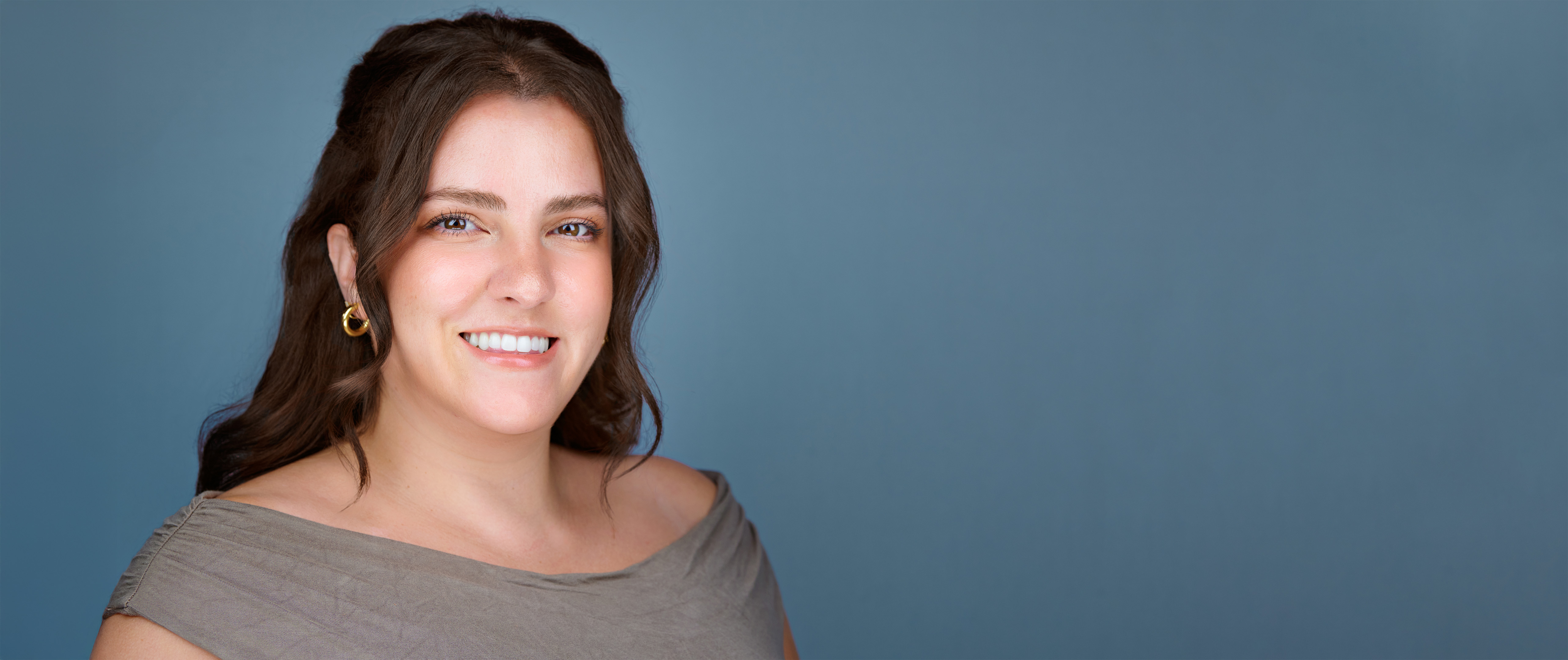 Professional headshot of Samantha Dalton used with her testimonial about a company headshot experience.