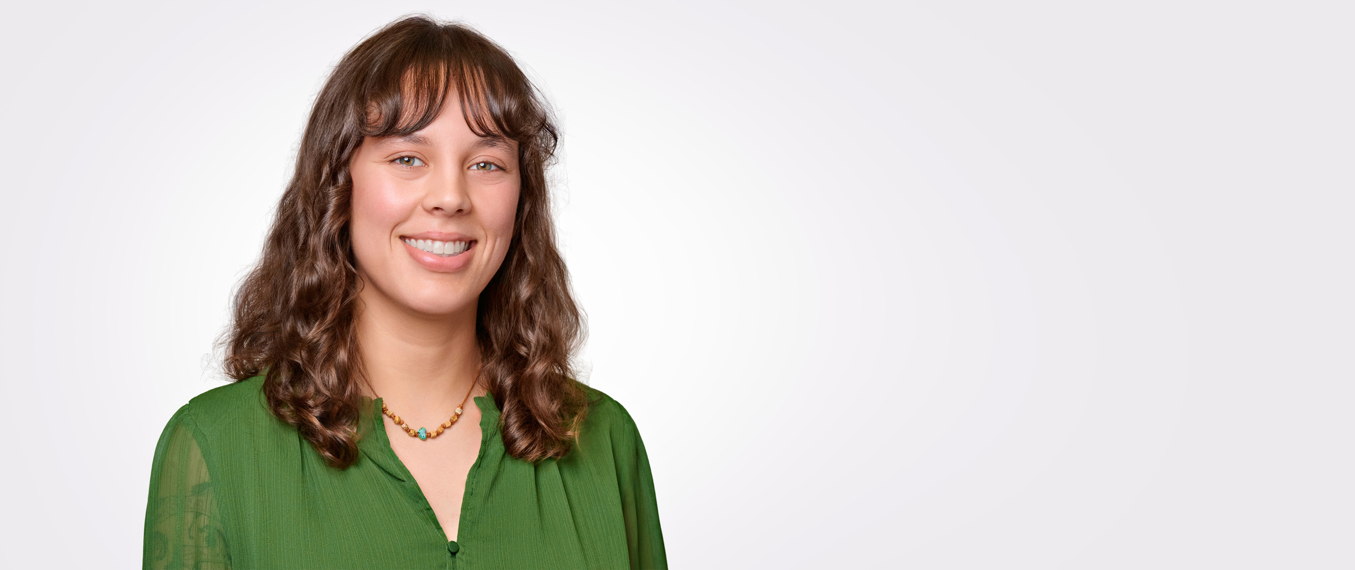 Alexis Lutter-Lee, Marketing Events Coordinator at Fenwick & West LLP, smiling in a professional headshot used to highlight her testimonial about the streamlined corporate headshot system.