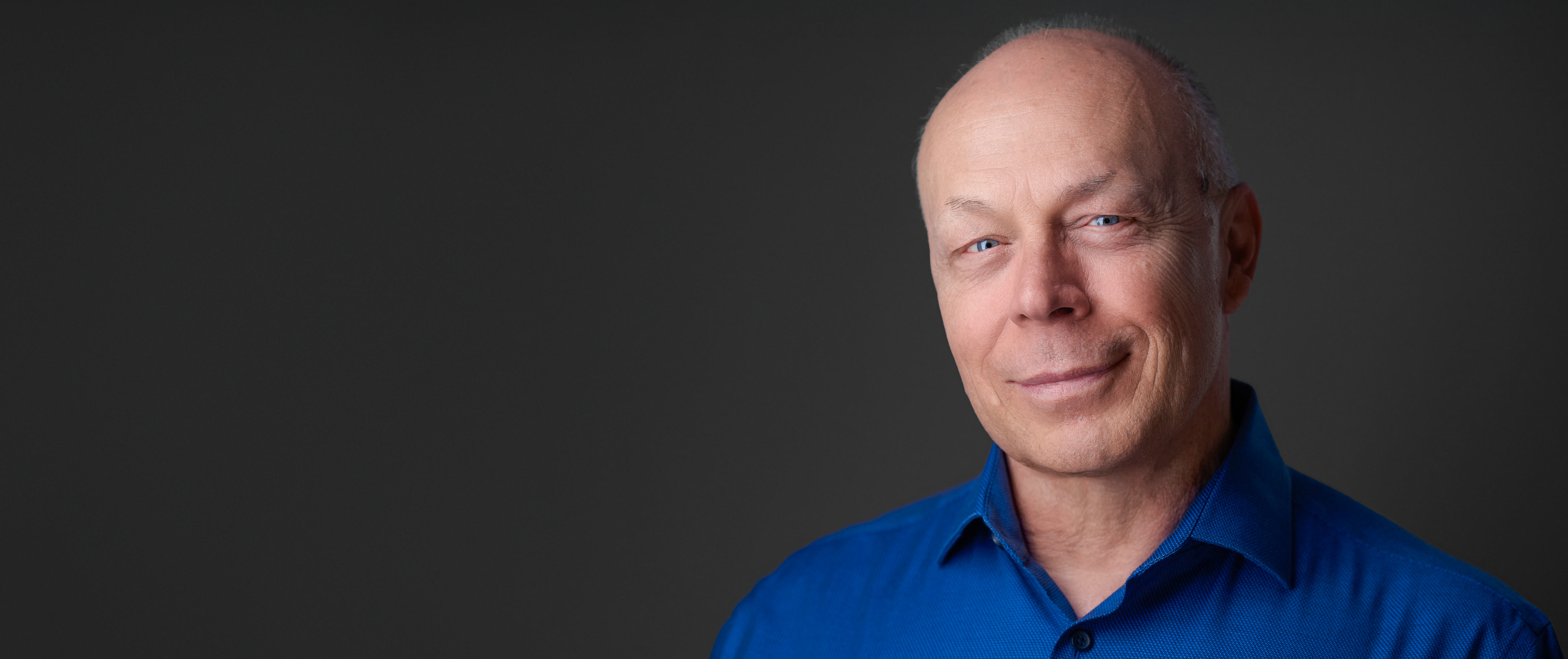 Professional headshot of photographer Dean Birinyi photographed for a Cupertino company headshot page.