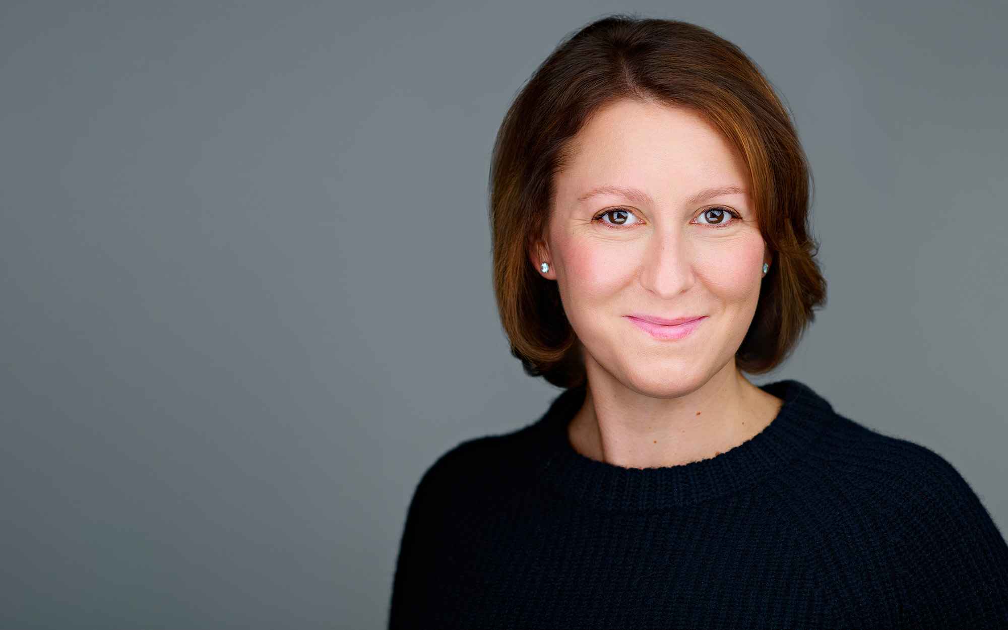 Polished professional portrait with studio styling support Professional portrait of a woman with studio hair and makeup preparation