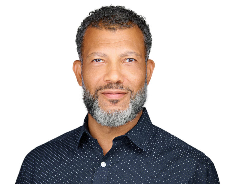 Executive headshot of a man with salt-and-pepper beard, photographed on location in San Mateo, CA.