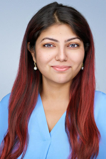 Professional corporate headshot of a woman with long red hair wearing a light blue blouse, photographed by Dean Birinyi Photography in Santa Clara, California. Displayed on the company headshot system page to represent inclusive, consistent portraits for Bay Area corporate teams.