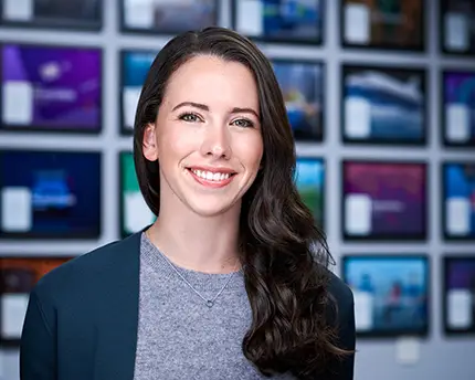 Businesswoman in gray sweater and dark jacket, photographed by Dean Birinyi for company headshots in Palo Alto.