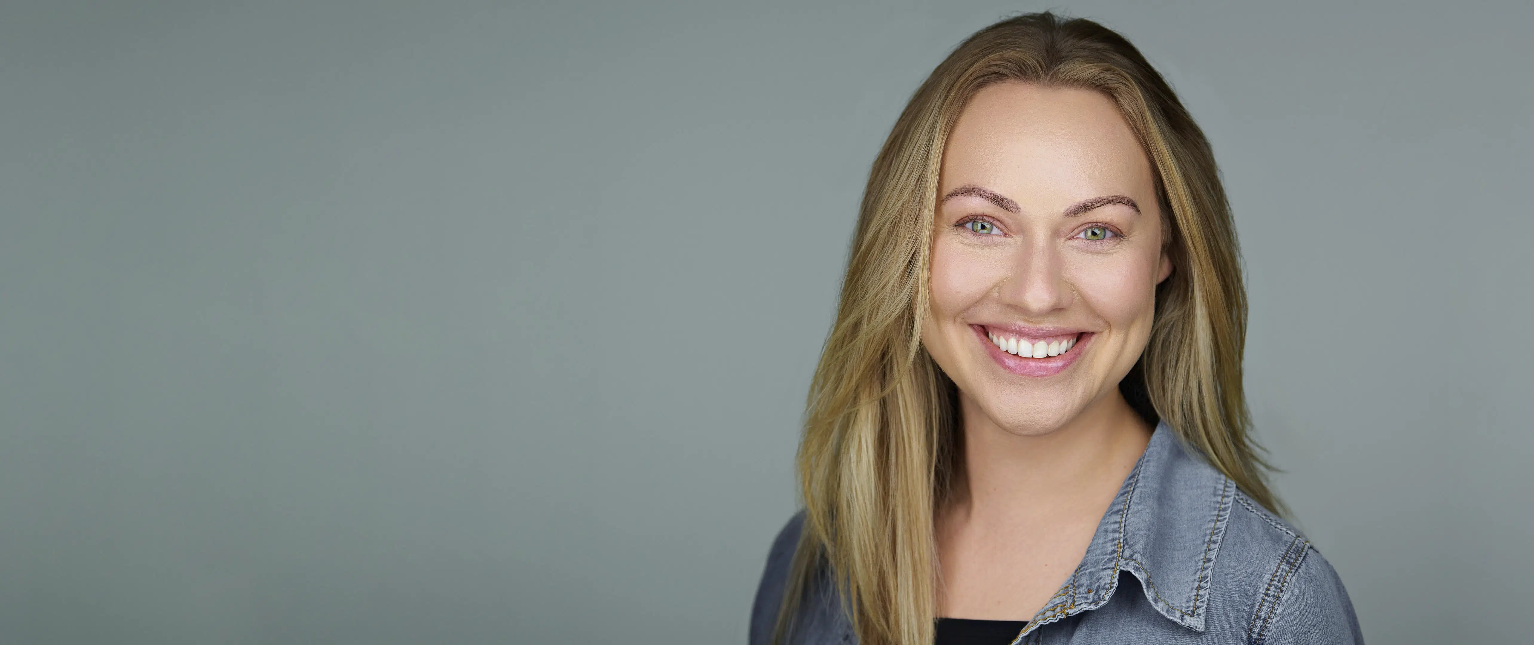 Professional headshot of a smiling woman used for a company-branded group headshot scheduling page in Silicon Valley.