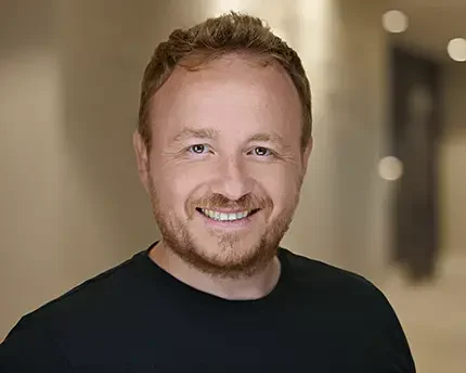 Professional corporate headshot of a team member photographed for company use
