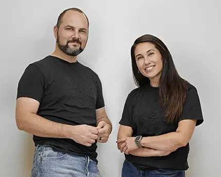 Group corporate portrait of two team members photographed for company use