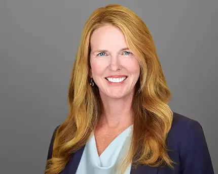 Professional corporate headshot of a South San Francisco employee on a neutral gray background