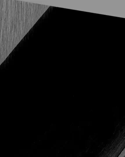 Minimal black-and-gray abstraction formed by intersecting diagonal planes and a textured vertical surface.